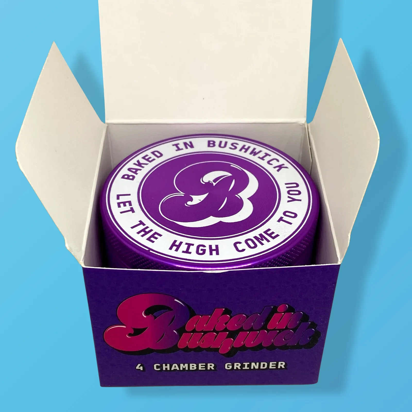Baked in Bushwick Purple Aluminum Grinder – 63mm 4-piece with Keif Catcher and mesh screen compartment.